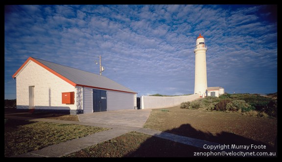 Cape Nelson shed and lighthouse 7:20am  3 May 1987 Arca-Swiss 5x4" monorail camera 90mm Linhof Angulon f22 1/4 second + polariser Fujichrome 50
